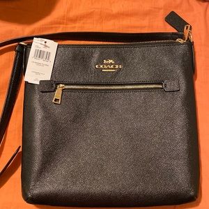 This is a leather coach crossbody. Brand new never been used.